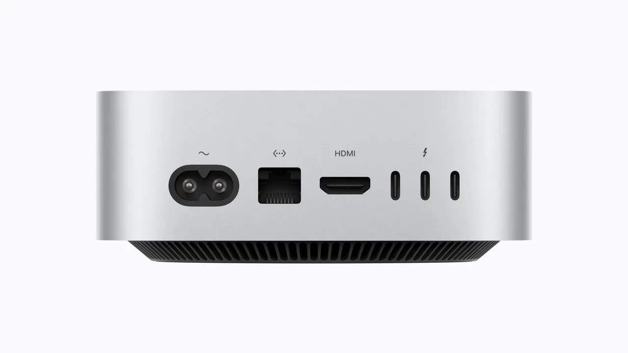 The back of the new Mac mini, with the power socket, Ethernet port, HDMI port and three Thunderbolt ports.