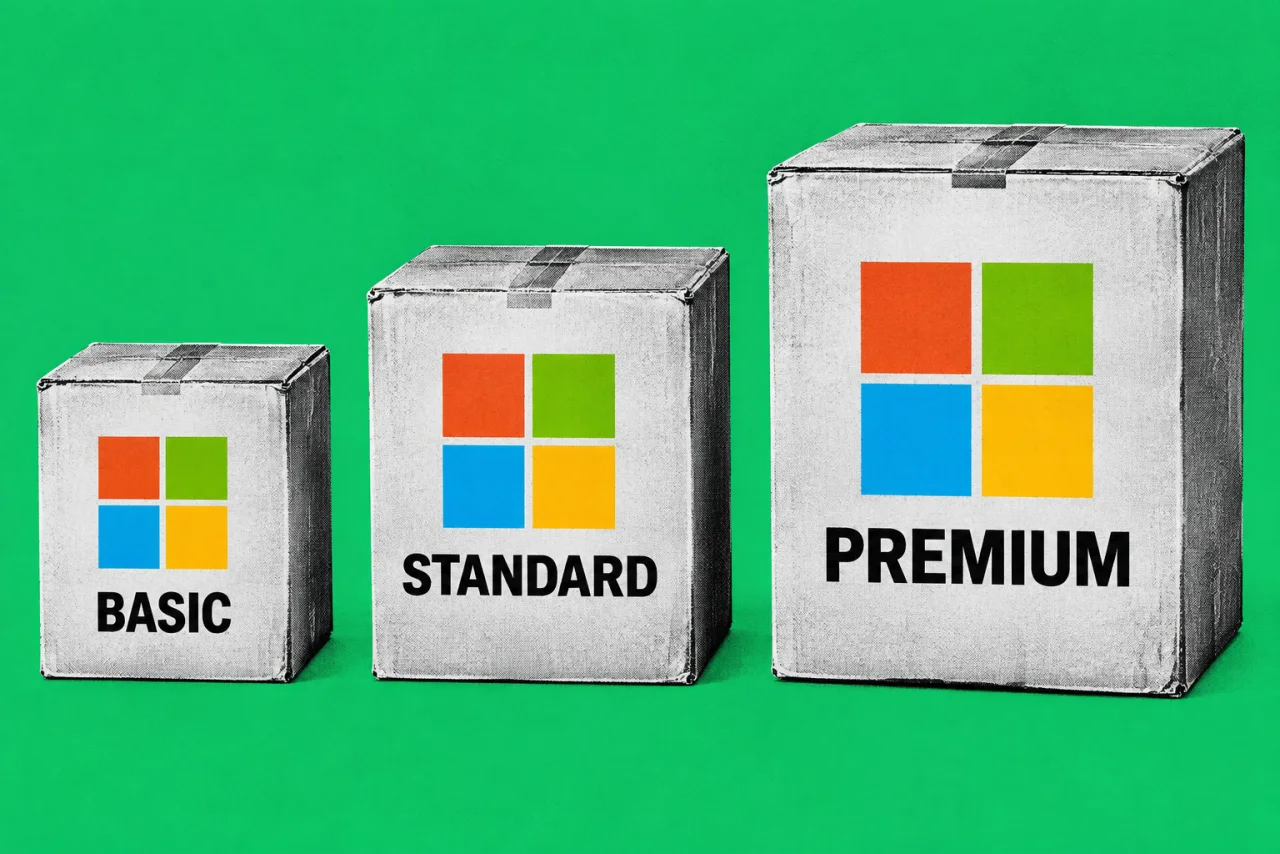 Three cardboard boxes of increasing size standing side by side, on an emerald background. The four-colour Microsoft squares logo on each box, and tags reading "BASIC", "STANDARD" and "PREMIUM".
